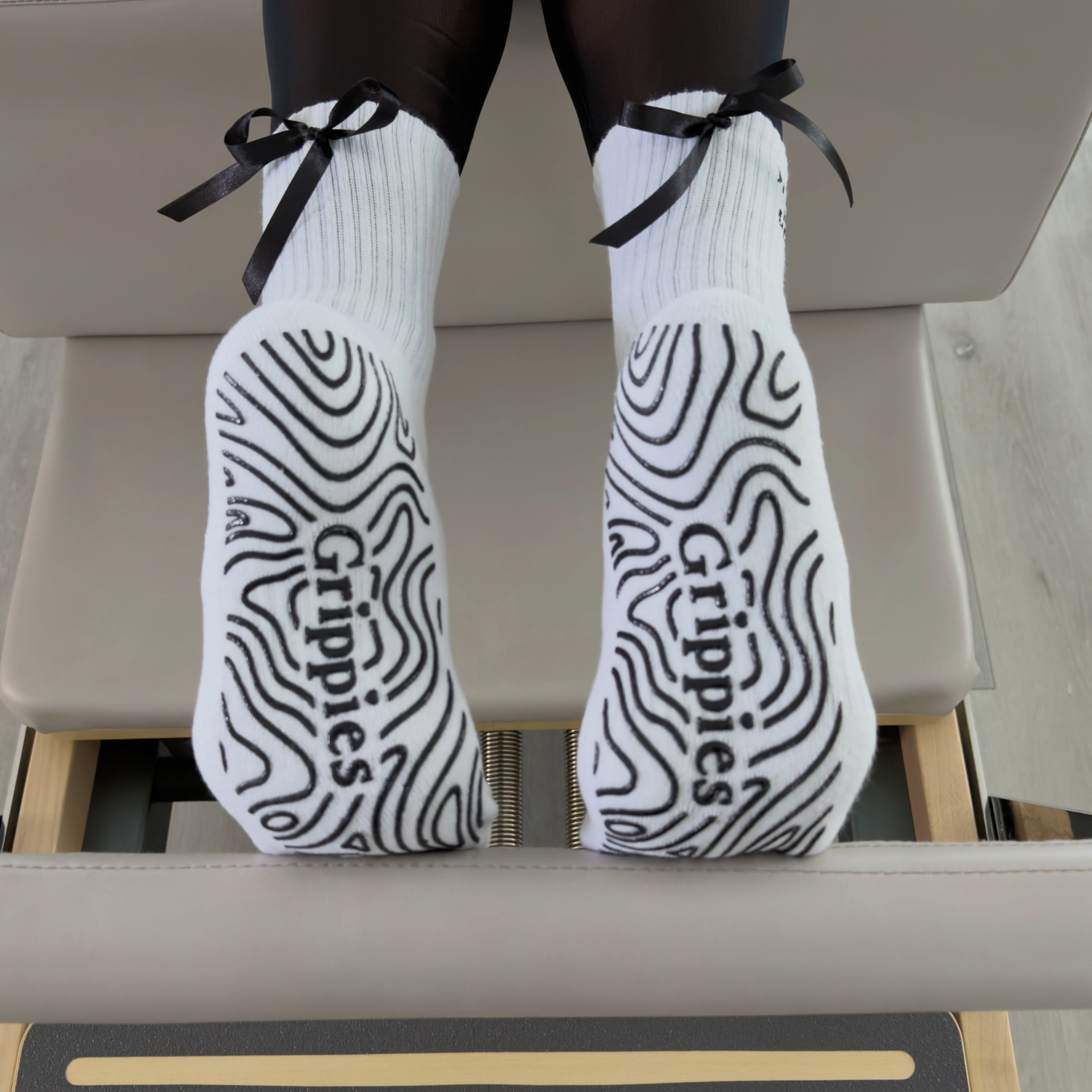 Grippies signature non-slip sole pattern and satin bows